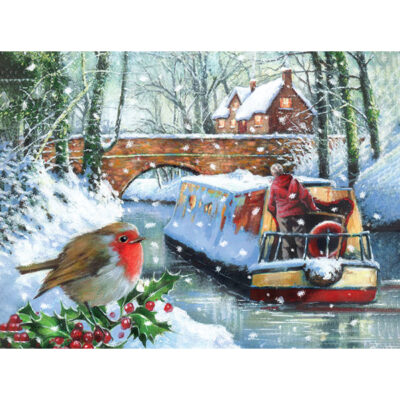 The illustration depicts a red robin in the bottom left corner sitting on a branch of holly looking across at a snow covered canal boat being slowly guided down the canal and under a bridge down the canal. Two village houses sit on the bridge with lights on. The canal path is lined by trees and covered in snow.